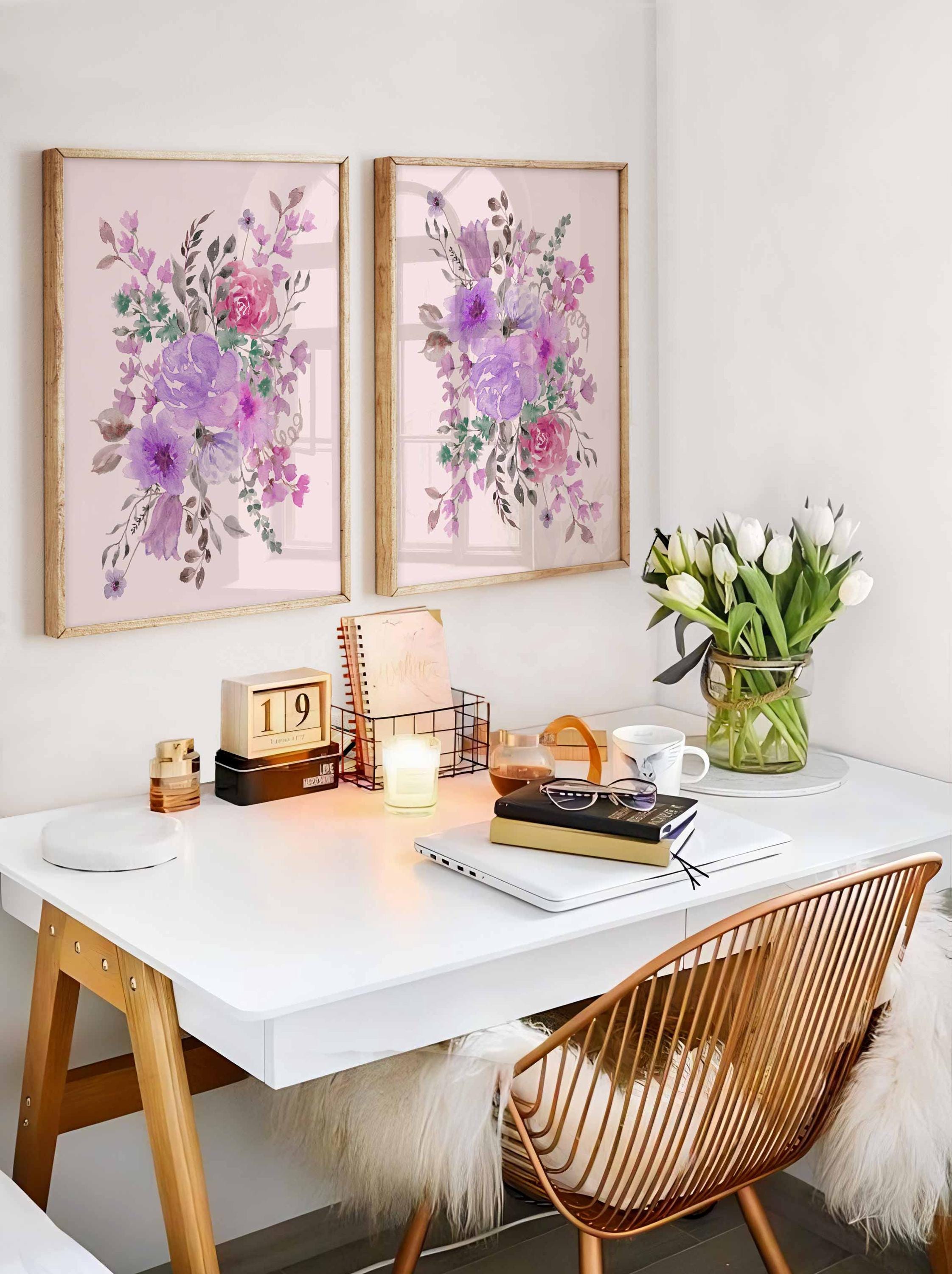 Two lilac and blush flower bunch prints above a desk with tulips