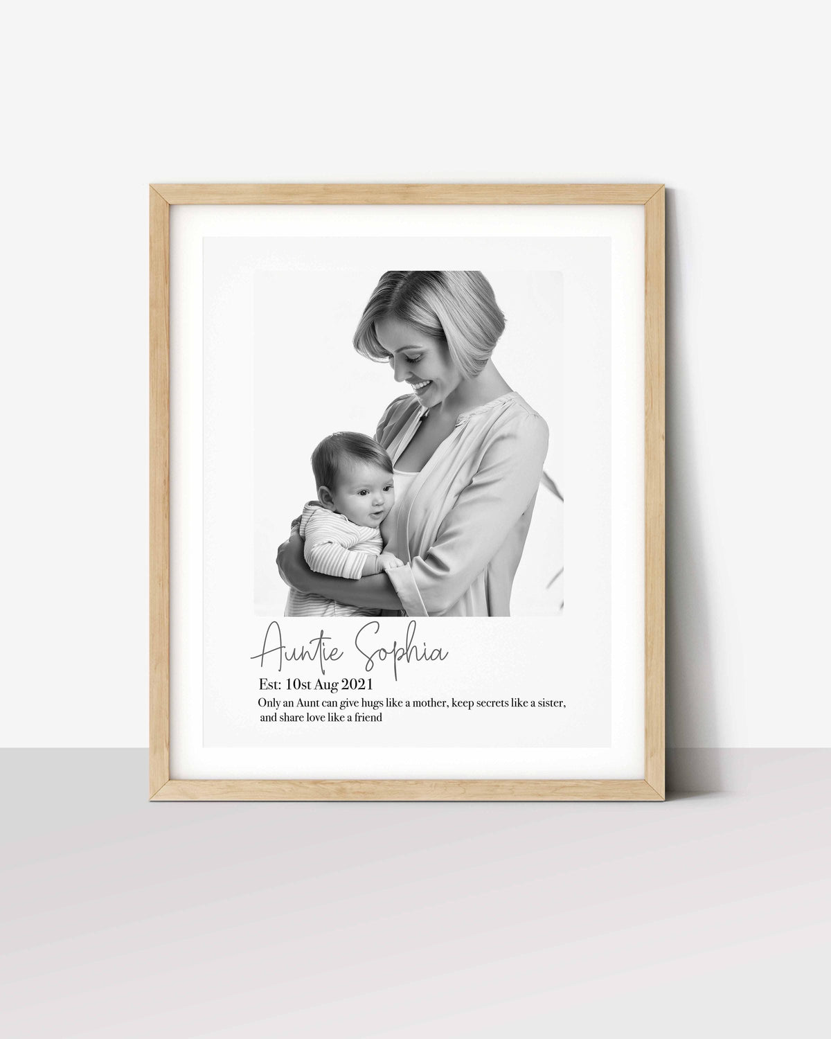 Personalized aunt gift print: black and white photo of Auntie Sophia holding a baby, with her name and a short quote Main image