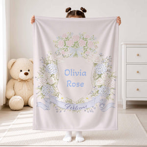 Child holding a hydrangea wreath blanket with Olivia Rose