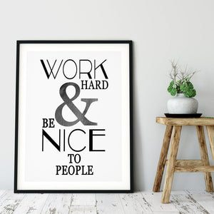Work hard and be nice to people in black and grey type in a black frame
