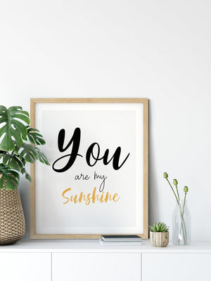 You are my sunshine in black script with yellow lettering, in a wooden frame