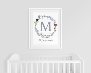 Wildflower wreath monogram M with Mariana below, above a white crib