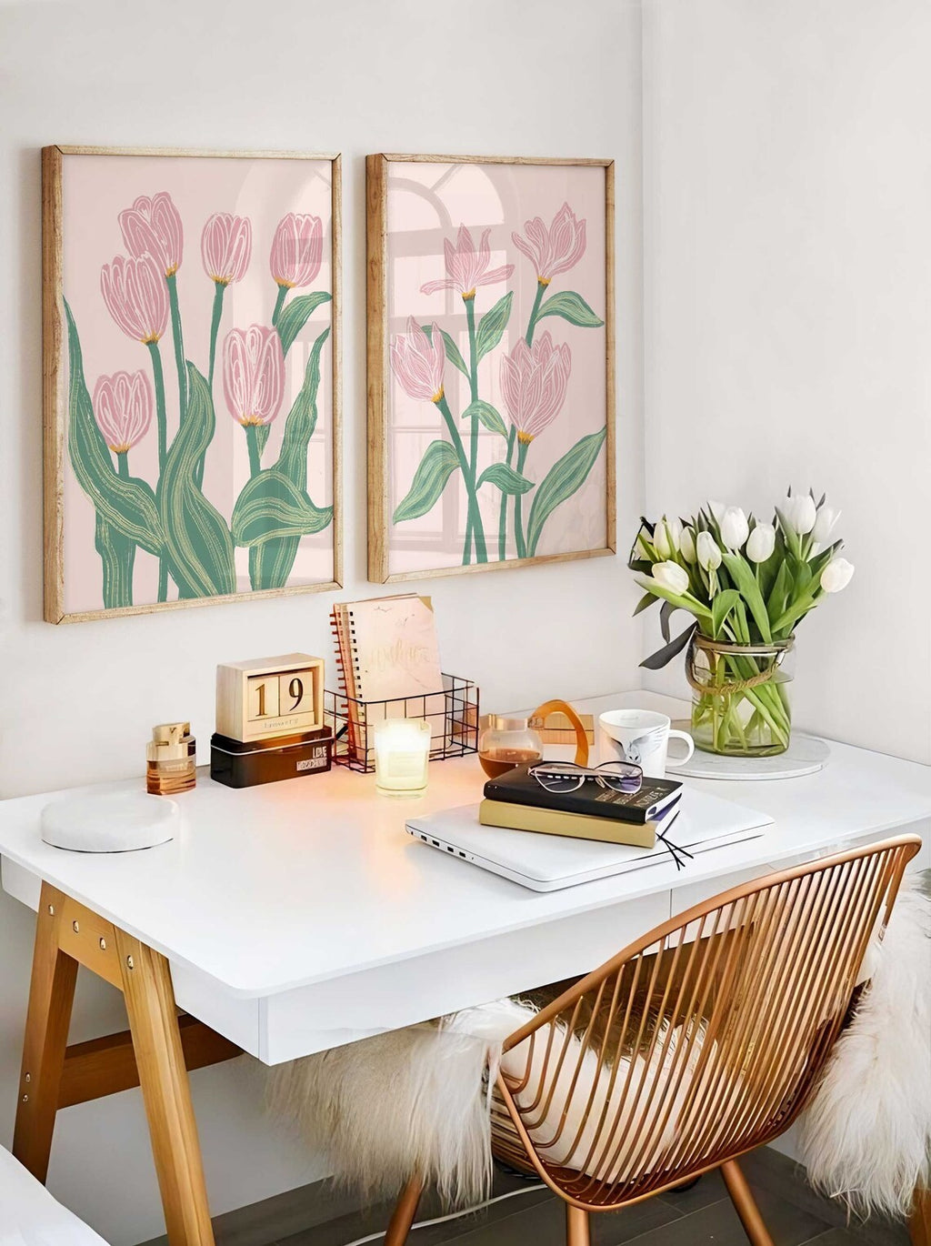 Two pink tulip flower market prints above a desk with tulips