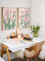 Two pink tulip flower market prints above a desk with tulips