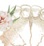 Close-up of the rose gold teeth and a blush flower